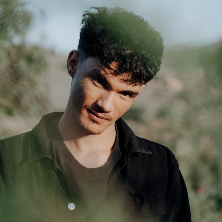 Avery Lee, Lead Design Curator at Horizon Peak Lab, reviewing corporate floral arrangements